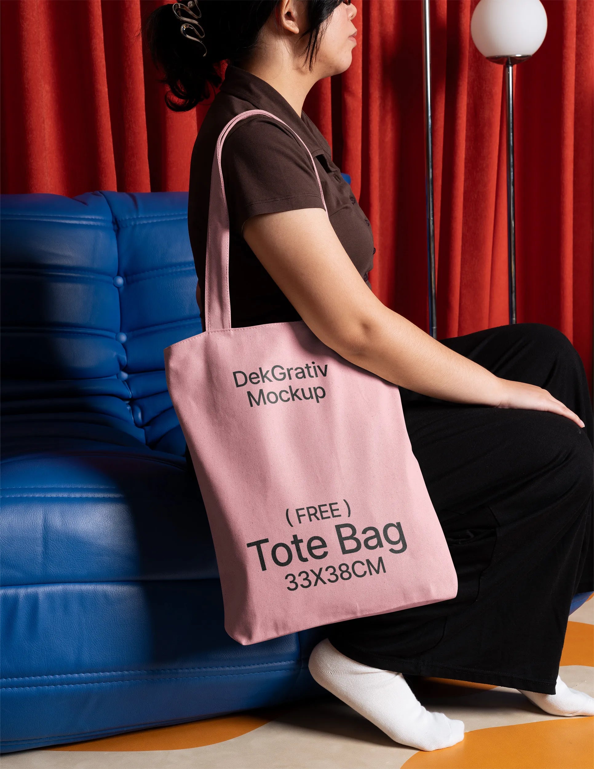Free Woman Carrying Tote Bag on Blue Couch Mockup