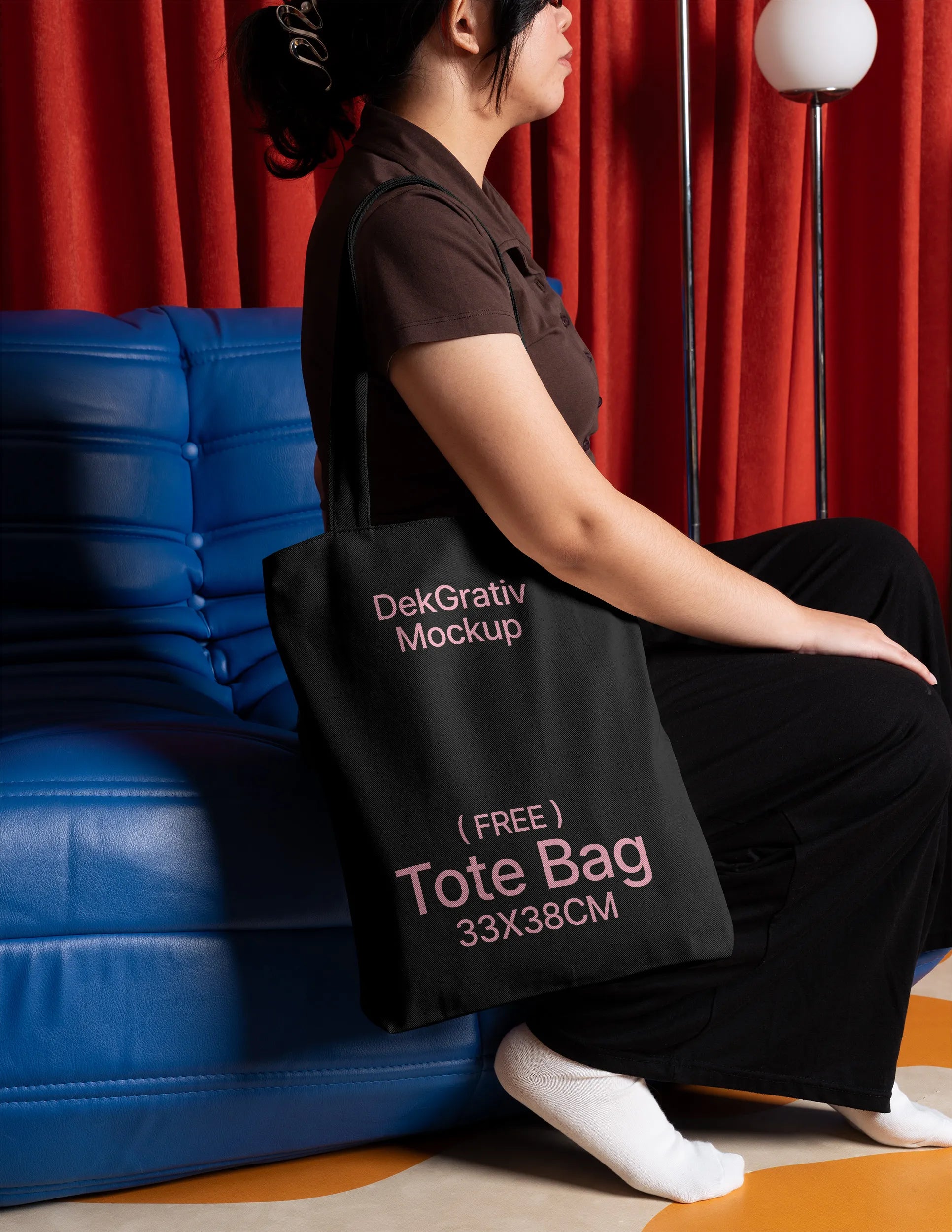 Free Woman Carrying Tote Bag on Blue Couch Mockup