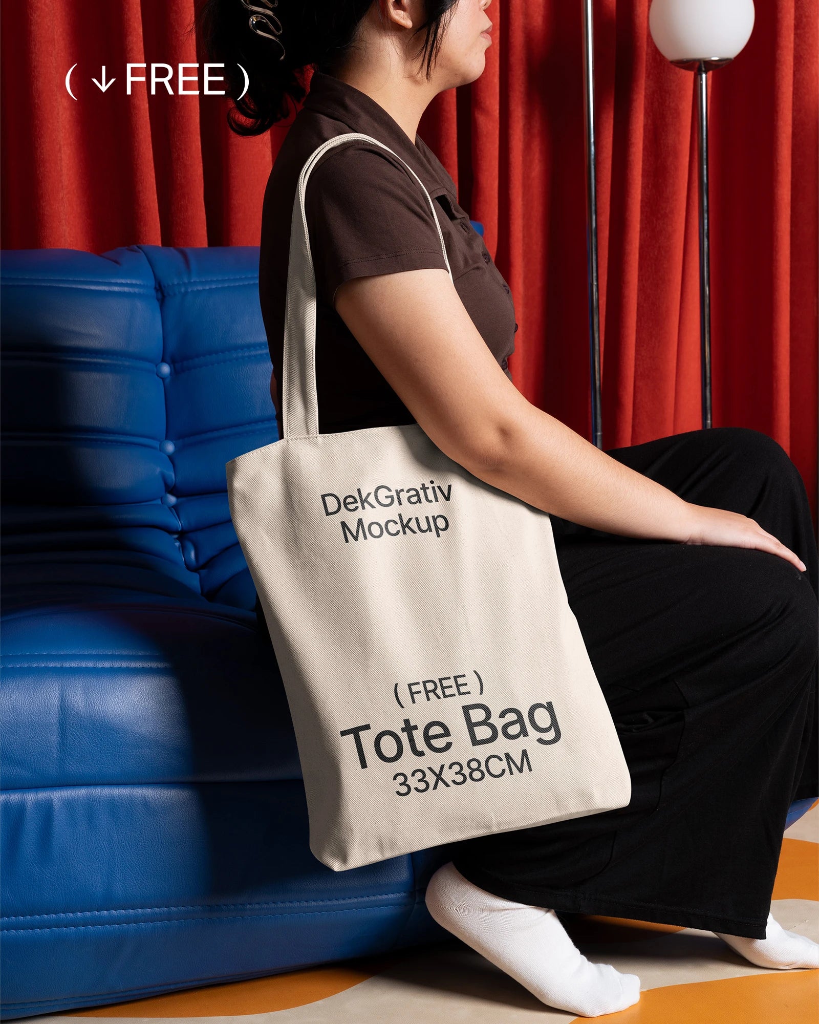 Free Woman Carrying Tote Bag on Blue Couch Mockup